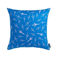 a blue pillow with pink arrows on it