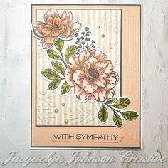 a card with some flowers on it and the words sympathy written in front of it