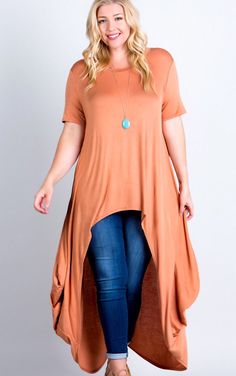 You will steal the show in this stunning tunic! These have always been best sellers, because they are SO incredibly comfy and flattering on every figure! High low style looks gorgeous paired with your favorite denim or white skinnies! Excellent quality knit in this beautiful spicy bronze color is gorgeous for fall! **Pic of olive included to show fit on all sizes. Runs a tad large. If in between, choose your smaller size. Small 4-6, Medium 8-10, Large 12-14, 1X 16-18, 2X 20-22, 3X 24-26 Length 5 Casual Fall Tunic, Casual Stretch Tunic For Fall, Casual Flowy Tops With Asymmetrical Hem, Casual Tunic For Fall Layering, Casual Stretch Tunic, Casual Asymmetrical Hem Tunic For Fall, Casual Fitted Tunic With Asymmetrical Hem, Casual Stretch Tunic For Spring, Fitted High-low Hem Tops For Fall