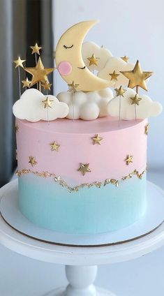 a cake with stars and moon decorations on top