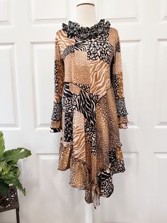 "This beautiful brown tunic top is made with double brushed stretchy material that is soft and very comfortable to wear. The Matching skirt is sold separately.  XS Bust 34\" S   Bust 35\" M  Bust 37\" L   Bust 39\" XL Bust 42\" 2X Bust 45\" 3X Bust 48\" 4X Bust 51\"" Brown Tunic, Printed Tunic Tops, Print Tunic, Womens Tunics, Stretchy Material, Womens Clothing Tops, Animal Print, Tunic Tops, Art Collection