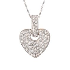 1.28 Carat pave diamond heart shaped pendant necklace. 14k yellow & white gold. Round brilliant cut Diamonds are Pavé set in a heart shaped pendant with an open circle for a large Diamond set bale. 16 inch white gold chain. 80 round Diamonds, approx. total weight 1.28cts, H – I, SI, 1.3 – 1.7mm 14k 2-tone gold 16 inch 14k white gold chain Tested and stamped: 14k 6.1 grams Top to bottom: 27.13mm or 1.07 inches Width: 19.58mm or .77 inch Depth: 3.78mm Opening: 4.8mm Luxury White Gold Heart Pendant Diamond Necklace, Luxury Heart-shaped Diamond Necklace With 17 Jewels, White Gold Heart Cut Diamond Necklace With 17 Jewels, Diamond White Heart Pendant Necklace With 17 Jewels, Heart Cut Diamond White Necklace With 17 Jewels, White Diamond Necklace For Valentine's Day Formal, Formal White Diamond Necklace For Valentine's Day, White Gold Heart-shaped Necklace With Pave Setting, White Gold Heart Cut Necklace With Pave Setting