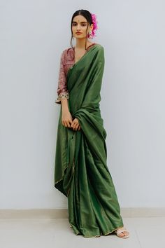 Emerald green saree with contrast woven stripes and zardozi embroidered border. Paired with printed magenta unstitched blouse fabric.
Component: 2
Fabric: Handloom Munga Silk
Color: Green
Blouse fabric: 1 metre
Note: Blouse worn by the model is not for sale - Aza Fashions Striped Saree, Saree Green, Saree Blouses Online, Saree For Women, Silk Saree Blouse, Green Saree, Blouse For Women, Blouse Online, Designer Gowns