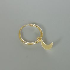 A PAIR of sterling silver hoops dipped in gold. Comes with a tiny crescent moon charm. The charm is multipurpose and can be used with a neck or bracelet chain too. Dimension: Hoop- 12x1 mm Charm- 4 x 9mm Drop length- 18 mm This piece is made of 925 hypoallergenic sterling silver. All my pieces are sent in a gift box. I can include a personal message from you if needed. You are welcome to contact me at... bhavnakwintra1956@gmail.com More hoops: https://www.etsy.com/your/shops/TheSilverGame/tools/ Moon Charm Hoop Earrings In Celestial Style, Gold Half Moon Hoop Earrings With Moon Charm, Gold Crescent Hoop Earrings With Moon Phase, Celestial Hoop Earrings With Moon Charm, Celestial Round Hoop Earrings With Moon Charm, Gold Celestial Hoop Earrings With Moon Charm, Gold Small Hoop Jewelry With Moon Charm, Celestial Gold Hoop Earrings With Moon Charm, Gold Jewelry With Moon Charm In Small Hoop