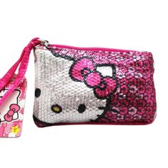 Lovely shimmering coin purse wristlet with iconic Hello Kitty Face in front. Size approx 5"x3" Size: small.  Color: Pink.  Gender: female.  Age Group: adult. Cute Cheap Hello Kitty Bags, Hello Kitty Coin Purse, Pink Hello Kitty Print Shoulder Bag, Trendy Hello Kitty Pouch Bag, Vintage Hello Kitty Purse, Trashy Y2k Aesthetic, Hello Kitty Face, Cat Coin Purse, Y2k Accessories