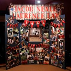 a display with pictures and flags on it in a room that is decorated for an event