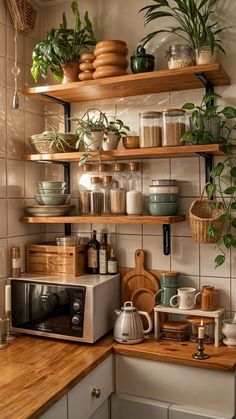 a kitchen with wooden shelves filled with pots and pans on top of the counter