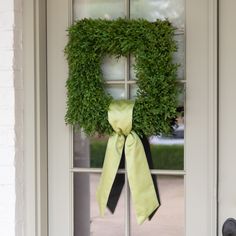 a door with a green wreath on it