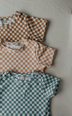 Introducing our adorable checkered short sleeve and short set for kids, the perfect addition to your little one's summer wardrobe! Made with high-quality, lightweight cotton material, this set is perfect for keeping your child comfortable and cool on warm days. The classic checkered design adds a fun and playful touch to the outfit, making it perfect for any casual occasion. The short sleeve shirt features a basic tee shirt, providing a smart and stylish look. The coordinating shorts have an ela Casual Cotton Gingham Sets, Casual Gingham Cotton Sets, Summer Plaid Short Sleeve Sets, Summer Plaid Sets With Short Sleeves, Summer Gingham Sets For Playtime, Summer Gingham Short Sleeve Sets, Summer Gingham Sets With Short Sleeves, Summer Gingham Playtime Set, Casual Plaid Sets For Summer