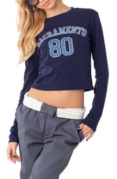 Show your Cali credentials in this cropped long sleeve tee with varsity-style Sacramento graphics. Crewneck Long sleeves 45% cotton, 45% polyester, 10% spandex Machine wash, dry flat Imported Blue Long Sleeve Tops With Logo Detail, Sporty Long Sleeve Go-dry T-shirt, Sporty Compressive Long Sleeve Crop Top, Sporty Stretch Cropped T-shirt With Graphic Print, Sporty Long Sleeve Blue T-shirt, Cropped Graphic Tees, Top Brands, Long Sleeve Tees, Tee Shirts