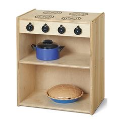 a wooden toy stove with blue pots and pans on the shelf next to it