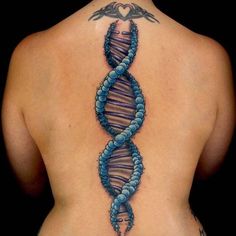 a woman's back with a tattoo on it that has an image of a strand of blue beads in the shape of a spiral