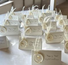 there are many place cards that have been placed on top of the table for guests to sign