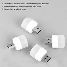 three white usb devices sitting next to each other