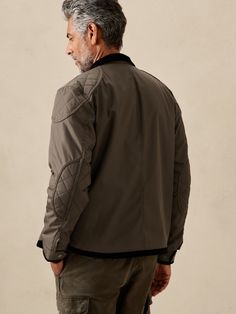 Moto imaginings flourish on this utilitarian style jacket inspired by earlier designs of the Royal Navy and reimagined in a super-sturdy recycled fabric.  Complete with a warm wool lining, quilted reinforcements to protect the shoulders and elbows, a Utilitarian Style, Elbow Pads, Dark Olive Green, Band Collar, Royal Navy, Moto Jacket, Recycled Fabric, Banana Republic, Rain Jacket