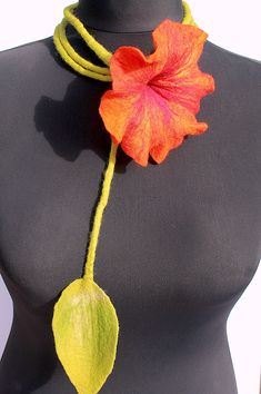 A very beautiful felted orange blossom with bourdauxfarbenen gradient as Filzkette. You can view the chain around his neck wear, but also as an ornament around the waist. Super well as the special jewelry for the bride. Very refined affects the flower necklace as a bracelet. Your imagination knows no bounds. The flower is orange with yellow gradient and the long stem is light green. The colors are beautiful, you'll be amazed. Size / Weight / Dimensions Length of the stem with flower 70,8 inch Fl Handmade Orange Flower Necklace, 70's Jewelry, Flower Outfit, Wool Necklace, 70s Jewelry, Yellow Gradient, Felt Necklace, Hippie Necklace, Neck Jewellery