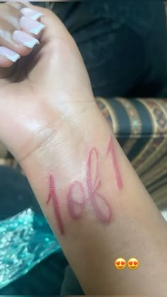 a woman's arm with the word love painted on it