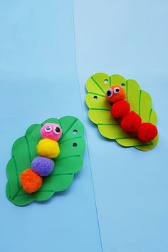 two paper plates with felt animals and leaves on them, one in the shape of a caterpillar