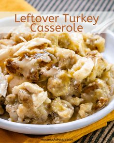 a close up of a plate of food with casserole in it and the words, leftover turkey casserole