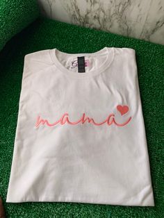 Look good and feel great in the Mama T-shirt! This unique t-shirt is made from soft, breathable cotton and features an embroidered design that looks amazing. Whether you're dressing up or dressing down, you'll stay comfortable while making a statement. What are you waiting for? Get your Mama T-shirt today! Beautiful embroidered T-shirt to celebrate every “Mama” Trendy Crew Neck T-shirt With Embroidered Text, Casual Crew Neck T-shirt With Custom Embroidery, Cotton T-shirt With Embroidered Text And Relaxed Fit, Cotton T-shirt With Embroidered Graphics, Crew Neck, Cotton T-shirt With Embroidered Text, Crew Neck, Cotton T-shirt With Embroidered Graphics, Pink Crew Neck T-shirt With Embroidered Graphics, Pink T-shirt With Embroidered Text For Summer, Trendy Cotton T-shirt With Custom Embroidery