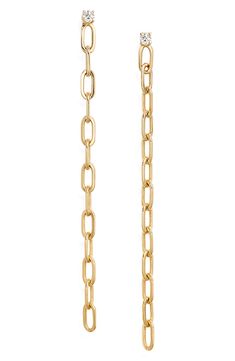 Set out to sparkle in these dainty 14-karat-gold drop chain earrings set with a faceted diamond stud. 1 3/4" drop, 1/8" width Post back Total diamond weight: 0.06ct. Color: G-H Clarity: SI1-SI2 14k gold/diamond Imported Yellow Gold Long Drop Chain Jewelry, Yellow Gold Long Drop Cable Chain Jewelry, Yellow Gold Cable Chain Long Drop Jewelry, Yellow Gold Cable Chain Jewelry With Long Drop, Classic Yellow Gold Earrings, Classic Gold Cable Chain Earrings, Formal Long Drop Cable Chain Jewelry, Gold Long Drop Cable Chain Jewelry, Gold Jewelry With Long Drop Cable Chain