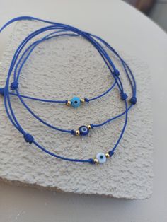 Handmade mini greek eye string bracelets, Comes in set of 3, Comes in branded gift box, All our products are handmade in our workshop and prepared carefully with jewelry boxes to deliver you the best gifts for your loved ones. Write us for any inquieries.  Minimalist evil eye frienship bracelets, bestfriend bracelets, bestfriend gift, gift for her, gift for mom, bracelet bundle for bestfriends. Affordable Blue Evil Eye Bracelet For Friendship, Blue Evil Eye Bracelet With Sliding Knot For Gift, Blue Evil Eye Bracelet With Sliding Knot As Gift, Bracelets Evil Eye, Greek Eye, Mini Bracelet, Mom Bracelet, Eye Bracelets, String Bracelets