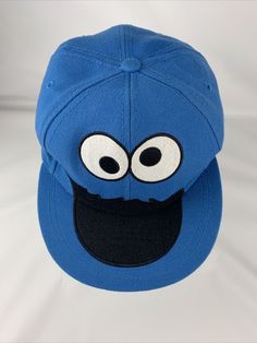 Cookie Monster Official Sesame Street Blue Baseball Cap Fitted Size S / M Hat. Some wear on inside head band Blue Cotton Baseball Cap With Flat Bill, Blue Cotton Flat Bill Baseball Cap, Playful Blue Cotton Hats, Blue Cotton Flat Brim Baseball Cap, Playful Blue Snapback Trucker Hat, Playful Blue Trucker Hat With Curved Brim, Fun Blue Snapback Hat With Flat Brim, Blue Fun Style Snapback Hat, Fun Blue Hat With Curved Brim