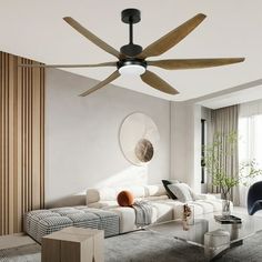 a living room with a couch, coffee table and ceiling fan that is mounted on the wall