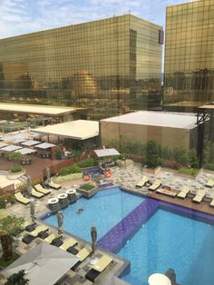 an aerial view of the pool and surrounding buildings