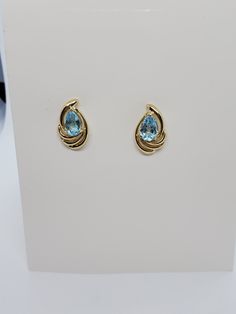 You are viewing a beautiful 14k solid gold topaz earrings. Pierced styleback. The total weight of the earrings approx.3.08 grams. Each earrings measures approx.17mm x 1mm wide. Marked 14k at the back. The earrings is in good condition. Anniversary Topaz Gemstone Earrings, Formal Blue Topaz Diamond Earrings Fine Jewelry, Formal Blue Topaz Diamond Earrings, Fine Jewelry Topaz Birthstone Earrings, Fine Jewelry Birthstone Earrings In Topaz, Yellow Gold Earrings With Blue Topaz Gemstone, Yellow Gold Topaz Earrings, Round Shape, Formal 14k Gold Fine Jewelry Earrings, Blue Topaz Birthstone Earrings For Anniversary