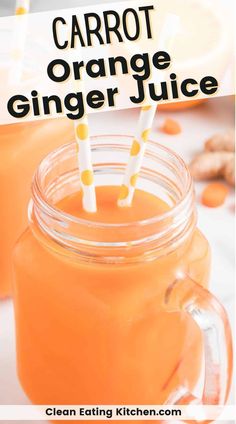 carrot orange ginger juice in a mason jar with two straws sticking out of the top