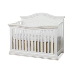 a white crib with no sheets on it