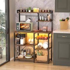 a kitchen area with a microwave, toaster oven and various food items on shelves