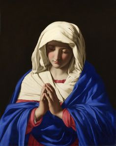 an image of the virgin mary holding her hands together