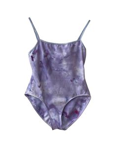 a woman's purple and blue swimsuit on a white background, with the bottom part of her body visible