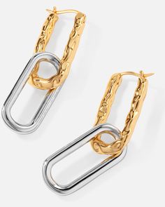 These slinky molten ovate hoop earrings are classic yet stylish and oh-so-versatile with their contemporary two-tone subversive-basic design. Molten detailing adds versatility to these minimalistic dangles, revealing your unique side to the world.
 
Size: 54x10.2mm
Material: 18k Gold & Rhodium Plated Rhodium Plated, Two Tone, Jewelry Box, Gold Bracelet, 18k Gold, Hoop Earrings, Personalized Items, Gold, Design