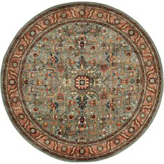 a round rug with an ornate design on the center and sides in red, green, blue