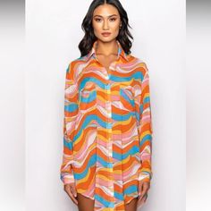 Sheer, Textured Fabric Point Collar Button Cuff Long Sleeves Rhinestone Embellished Button Up Closure Groovy Swirl Print Ddual Front Pockets Oversized Silhouette 100% Polyester Chic Multicolor Blouse With Buttons, Orange Buttoned Blouse For Spring, Orange Button Blouse For Spring, Multicolor Beach Shirt For Fall, Chic Multicolor Blouse With Button Closure, Multicolor Button Closure Blouse For Day Out, Chic Multicolor Shirt With Button Closure, Long Sleeve Orange Blouse For Vacation, Multicolor Blouse With Button Closure For Day Out