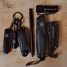 several different types of knifes and keys on a table