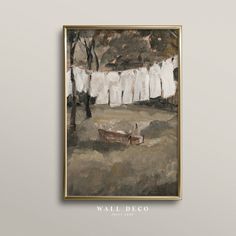 a painting hanging on the wall with clothes hung to dry in front of it,