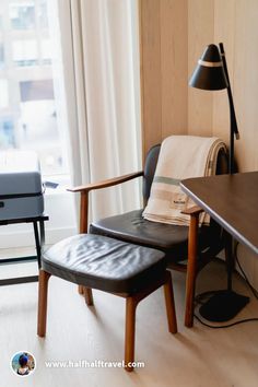 a chair and desk in front of a window