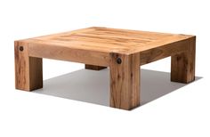 a square wooden table with buttons on the bottom and legs, made out of wood