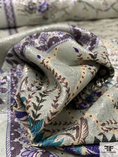 SKU: 15544 Content: Polyester / Lurex Color: Sage / Purple / Cream / Brown Width: 59 inches Multicolor Silk Embroidered Fabric For Party, Elegant Multicolor Fabric For Festivals, Sage Purple, Nyc Design, Floral Theme, Fabric Gifts, Fashion Fabric, Cream, Purple