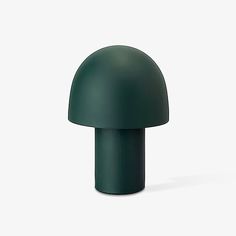 a green mushroom shaped object on a white background