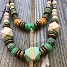 Put this on and walk out the door comfortable that your outfit is pulled together. These necklaces are great for layering, they are light weight and suede strap around back will have you thinking why aren't all necklaces made like this. The beads are a mix of the past 20 years of my jewelry making journey. Thee is wood, ceramic and brass mixed with African recycled glass, a mix of beads that will catch your eye. Each necklace is unique, I never make the same thing twice. I don't believe I'm cook Adjustable Green Rustic Necklace, Adjustable Rustic Green Necklace, Bohemian Single Strand Beaded Necklaces For Layering, Bohemian Turquoise Necklaces For Layering, Bohemian Double Strand Necklaces For Everyday, Everyday Bohemian Double Strand Necklace, Bohemian Single Strand Beaded Necklaces For Everyday, Bohemian Double Strand Layered Necklace, Bohemian Beaded Necklaces With Large Beads For Everyday