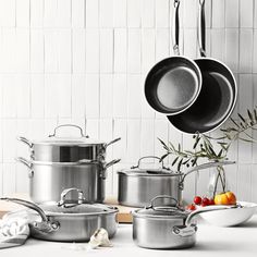 pots and pans are lined up on the counter