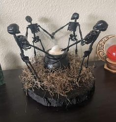 a group of skeleton candles sitting on top of a table