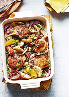 a casserole dish filled with meat and vegetables