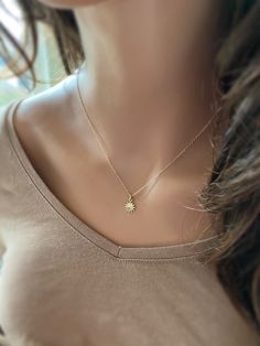 "This solid 14k gold charm is stunning and has a great detail. The slightly curved sun beams and its dome shape add dimension. The pendant measures approximately 8 mm. Now available with the 16 or 18\" dainty solid 14k gold chain. The sun will be suspended on 4 mm open bail (see 1st photo) If you only purchasing the charm, select bail size: 4 mm 14k open jump ring bail and can accommodate chains up to 1.6 mm. 6 mm 14k closed bail that can suit thicker necklaces. Hallmarked 14K 14k sand dollar ch Everyday Yellow Gold Sun Design Jewelry, Everyday Yellow Gold Jewelry With Sun Design, Dainty Starburst Yellow Gold Jewelry, Gold Charm Necklace With Sun Design, Elegant Sun Design Starburst Jewelry, Elegant Starburst Sun Design Jewelry, Gold Jewelry With Sun Design In 14k Gold, 14k Gold Starburst Jewelry Gift, 14k Gold Starburst Jewelry For Gift