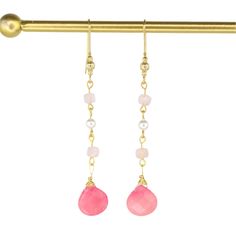 These elegant hand-wired earrings showcase a classic drop design adorned with two pink Jade gemstones, four pale pink Morganite stones, and two luxurious South Sea Pearls. With a 3.25" drop and crafted from gold-plated metal, they add a refined touch to any look. Pink Jade is believed to promote love, reduce stress, and bring luck, while pink Morganite is believed to foster joy and emotional calm. South Sea Pearls are thought to enhance clarity, aid self-expression, and boost self-esteem, making Pearl Charm Necklace, Pink Morganite, Sea Pearls, South Seas, South Sea Pearls, Pearl Gemstone, Pearl Charms, Drops Design, Pearl Drop